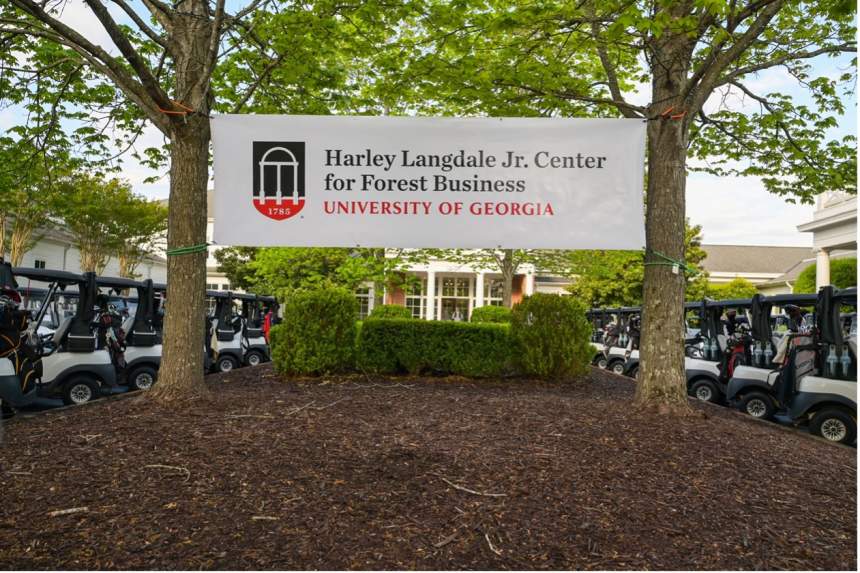 Harley Langdale Center for Forest Business banner across two trees