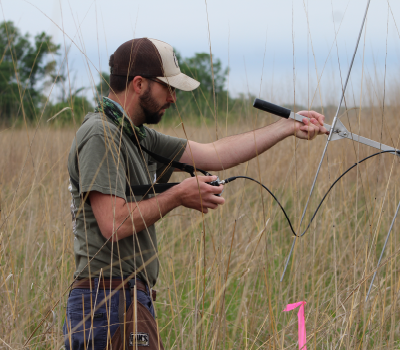 Student uses radio telemetry to track study animal.