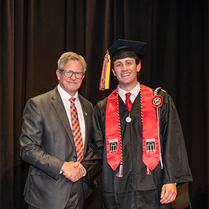 Ryan Testino stands with Dean Todd Petty
