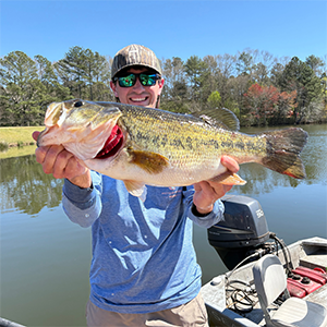 Ryan holds largemouth bass