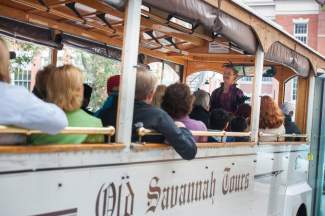 Tourists ride on a trolley in Savannah