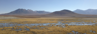 A desert scene looking over mountains