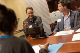 People talk in an office setting