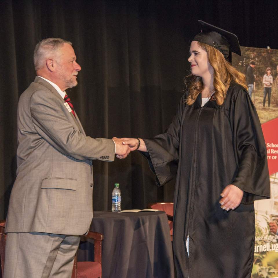 Dean Greene congratulates graduates