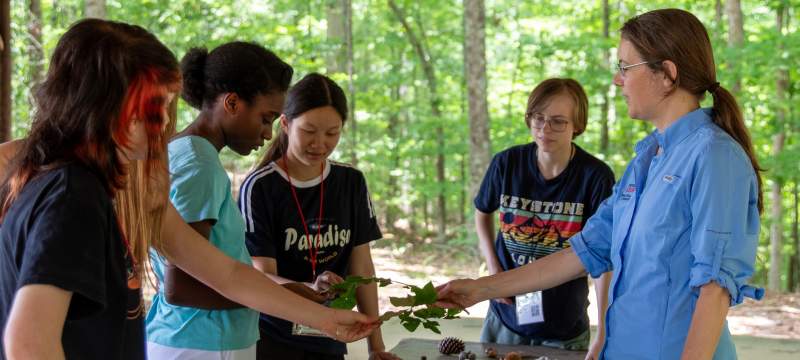 Holly Campbell shows students how to ID leaves