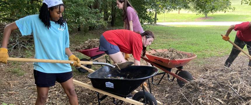 Ambassadors load up mulch for a trail project