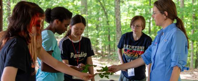 Holly Campbell shows students how to ID leaves