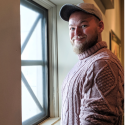 man standing at window