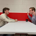 Students sitting at restaurant table talking