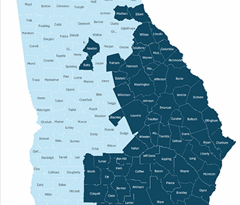 Map of Georgia showing designated disaster areas shaded in dark blue, covering the central and southeastern counties of the state.
